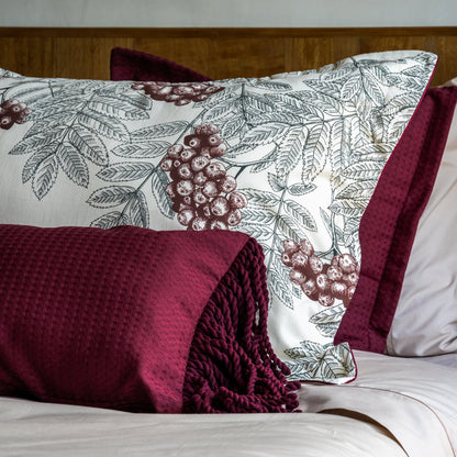 Funda piquet para cojín con flecos Vinotinto